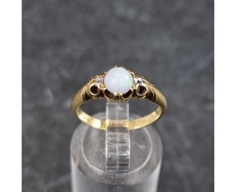 A Victorian yellow metal opal and diamond three stone ring, the shank engraved 'M.M.R died 19th April 1878', size L.