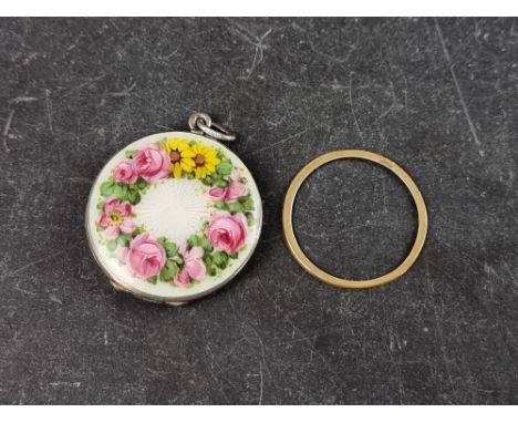 A continental white metal and guilloche enamel floral locket, the suspension ring stamped '800', 30mm diameter.