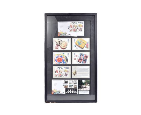 The Beatles - Royal Mail - a large framed Beatles stamp presentation featuring various items relating to 2007 stamp issues. I