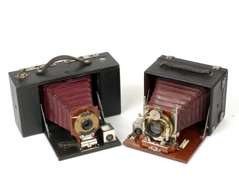 Two 1/4 Plate Red Bellows Folding Cameras. Comprising a Kodak No.3 Folding Brownie (condition 5F) with additional accessory p