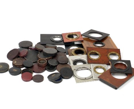 A Small Quantity of Lens Caps, Mostly Early/Vintage. Also a small number of lens panels, including a stereo panel. (From the 