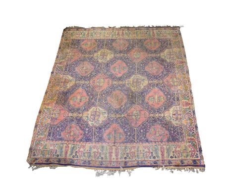 Small Caucasian carpet, with purple ground filled with pink tiled medallions, enclosed by stylised borders, 280cm x 222cm.Con