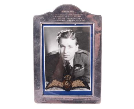 Guy Gibson interest; RAF cloth wings, with a monochrome photograph of Gibson in a silver plated frame engraved "Dam-Busters. 