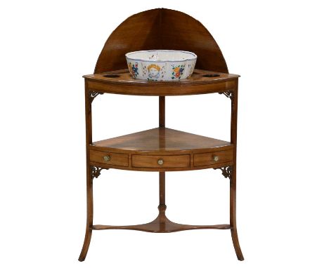 Victorian mahogany corner washstand, with a basin recess, splayed legs, width 67cm, height 108cm, modern pottery bowl.