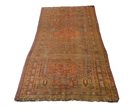 Large antique Persian Qashqai carpet, with three large medallions, worn and as found, 450cm x 194cm.