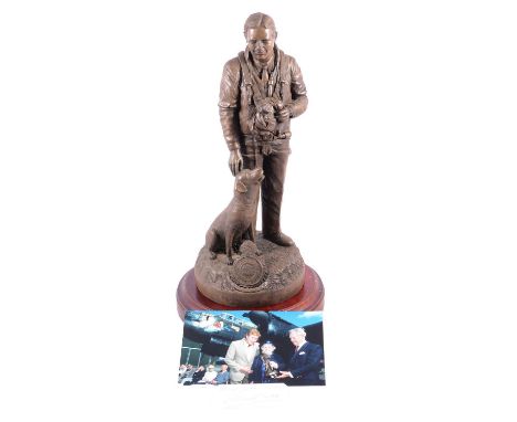 Barnard, composition statue of Guy Gibson with his dog, on a mahogany circular plinth, overall 45cm, a photograph of Richard 