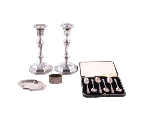 Pair of silver candlesticks, marks worn, weighted, 21cm, set of six silver teaspoons, cased; silver ashtray; silver napkin ri