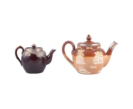 Royal Doulton stoneware teapot, silver mounted; and a treacle glazed teapot, with silver mounts.Qty: 2