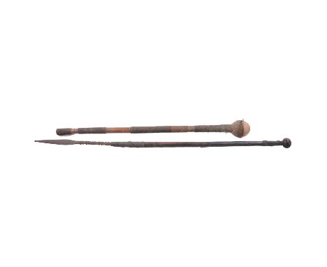 A wire-bound knobkerrie, 68cm, and a tribal fishing spear, barbed shaft below a leaf shaped blade, wire-bound hardwood shaft 