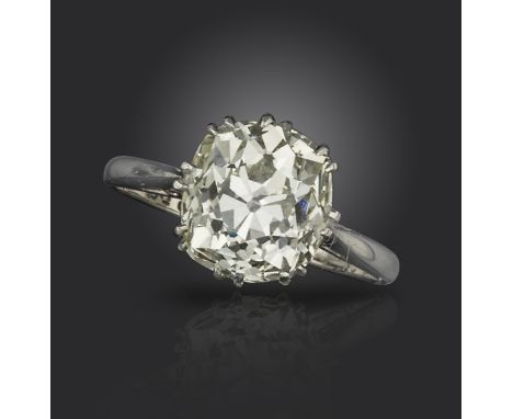 A diamond solitaire ring, the old cushion-shaped diamond weighs 3.82cts, claw-set in platinum and white gold, size K 1/2