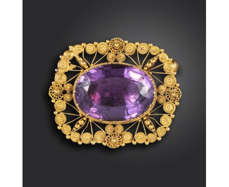 A Regency amethyst gold brooch, the oval amethyst set within cannetille surround in closed-back yellow gold setting, 3.5cm wi