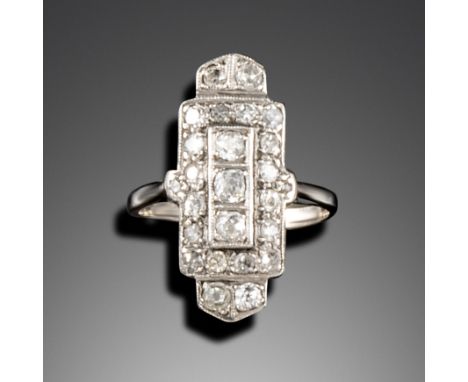 An Art Deco diamond plaque ring, set with graduated old cushion-shaped diamonds in white gold, size N