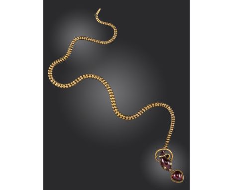 A Victorian garnet and diamond snake necklace, the stylised serpent with a cabochon garnet head suspends a garnet heart on go