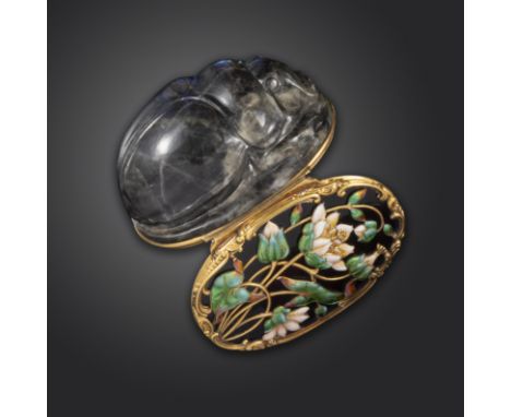 A mid 18th century carved labradorite scarab-form snuff box, the hinged blue glass cover decorated with polychrome enamel wat