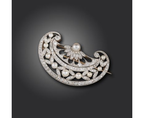 A Belle Epoque pearl and diamond brooch, the stylised fan is pierced and set with diamond and pearl laurels in platinum and g
