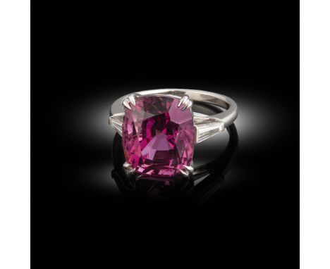 A pink spinel and diamond ring, the cushion-shaped spinel weighs 11.24cts, set with a tapered baguette-shaped diamond to each