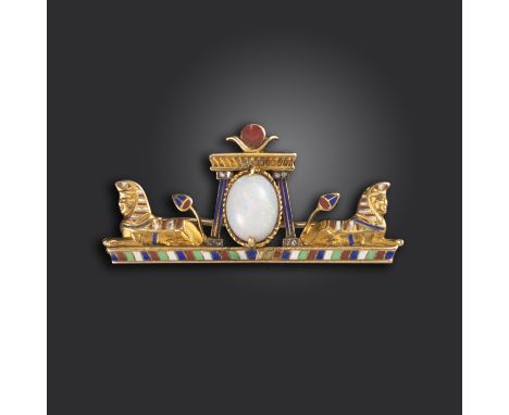 An early 20th century Egyptian Revival brooch, centred with an oval opal between two sphinxes and lotus flowers, decorated in