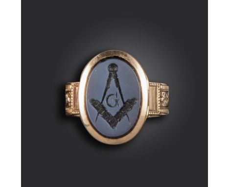 A Masonic gold locket ring, set with a hardstone intaglio with Masonic engraving, on foliate engraved band with hinged compar