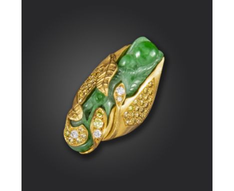 A jade and diamond ring by Geoffrey Rowlandson, the carved and pierced jade set in a foliate textured 18ct yellow gold mount,