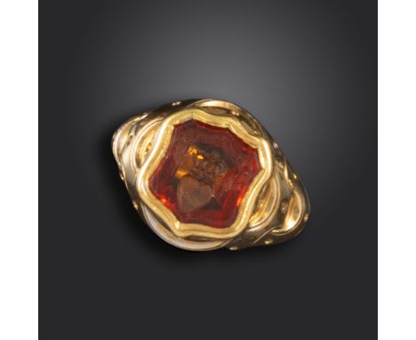 A late 19th century gold shield-form signet ring for the Douglas clan, the hessonite garnet intaglio carved with a striated h