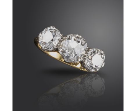 A diamond three-stone ring, set with three old cushion-shaped diamonds weighing approximately 3.00cts total, set in platinum 