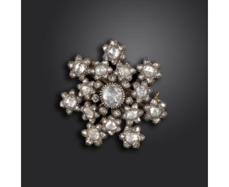 A 19th century rose-cut diamond brooch, designed as a snowflake and set overall with graduated rose-cut diamonds in closed-ba