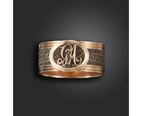 A George III gold mourning ring, the fluted gold shank set with plaited hair and the initials GA, with inner inscription for 