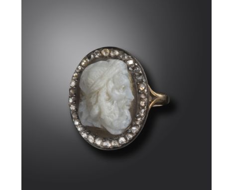 A 19th century hardstone cameo depicting the head of Zeus, in a 19th century ring set with a surround of rose-cut dimonds in 