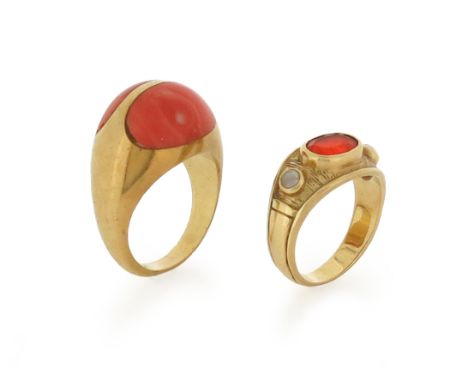 λ A coral-mounted gold bombι ring, set with two coral cabochons in yellow gold, size P, with a fire opal and seed pearl ring,