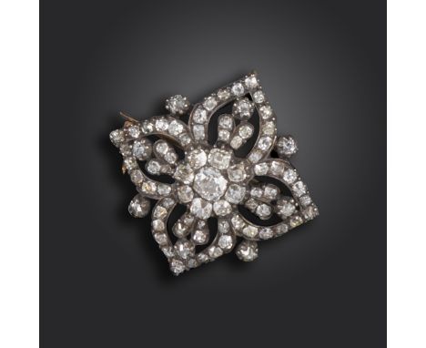 A George III diamond quatrefoil brooch, of bombé form, set with old cushion-shaped diamonds in silver on gold closed-back set
