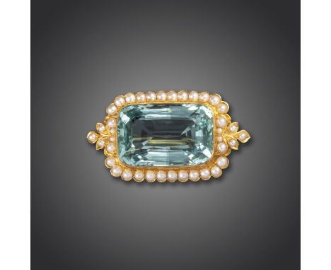 A late Victorian aquamarine and seed pearl brooch, the large cushion-shaped aquamarine set within a border of seed pearls in 
