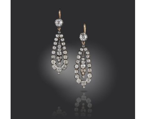 A pair of 19th century diamond drop earrings, set with graduated old cushion-shaped diamonds in silver and gold cut-down coll