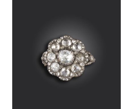 A diamond cluster ring, of flowerhead design and set with rose-cut diamonds in silver on gold closed-back setting, with furth