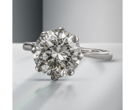 A diamond solitaire ring, the round brilliant-cut diamond weighs 7.08cts, claw-set in white gold, size V : Accompanied by rep