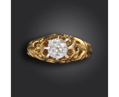 A 19th century diamond solitaire ring, the old cushion-shaped diamond is set within gold scroll surround, size K Family tradi