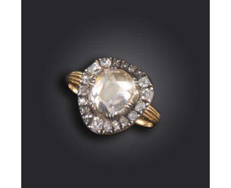 A George III diamond cluster ring, centred with a foil-backed pear-shaped diamond in cut-down silver collet, set in a heart-s