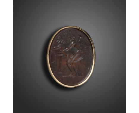 A 19th century erotic glass intaglio, depicting a winged adult Cupid in a passionate embrace, within yellow gold mount, size 