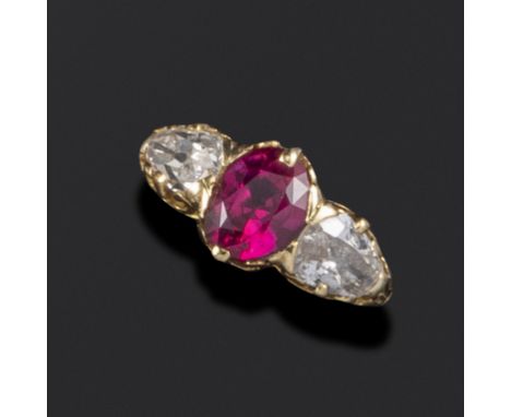 A Victorian ruby and diamond three-stone ring, set with an old oval-shaped ruby and two old pear-shaped diamonds, with pierce