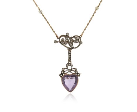 An Edwardian amethyst and diamond heart pendant, the amethyst heart suspended from a diamond-set scroll and bow in silver and