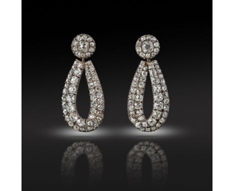 A pair of late George III diamond drop earrings, the old cushion-shaped diamond clusters suspend articulated demi- hoops set 