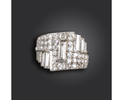 An Art Deco diamond ring, of geometric design, set with baguette-shaped and circular-cut diamonds in platinum, size J