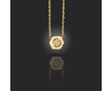 A diamond-set gold pendant by Cartier, designed as a hexagonal bolt finial, pave-set to the centre with single-cut diamonds i