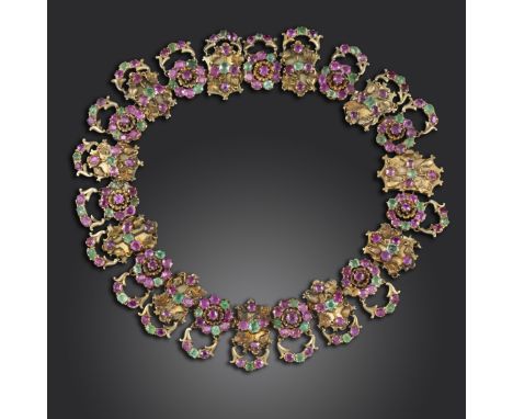 A 19th century ruby and emerald collar necklace, formed as a series of openwork and scrolling links decorated with applied fo