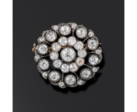 A late Victorian diamond target brooch, set with old circular-cut diamonds in concentric circles in silver and gold, 2.5cm wi