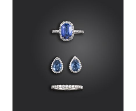 A sapphire and diamond suite of jewellery, including a sapphire and diamond cluster ring, the cushion-shaped sapphire weighs 