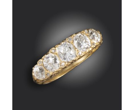 A diamond five-stone ring, the graduated old circular-cut diamonds set in 18ct yellow gold, each separated with a rose-cut di