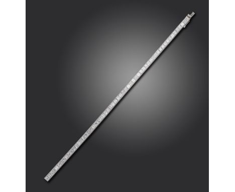 A diamond line bracelet, the square-shaped diamonds channel-set in platinum, 4mm wide, 18cm long, case