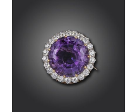 An Edwardian amethyst and diamond brooch, the circular-cut amethyst set within a surround of old circular-cut diamonds in pla