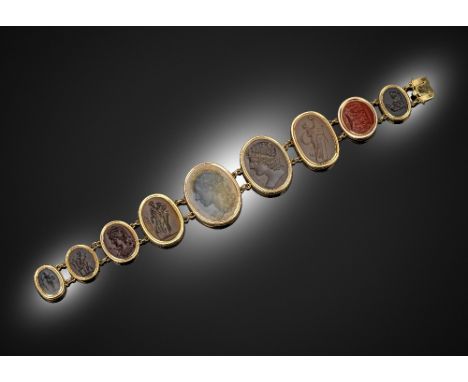 A 19th century bracelet mounted with nine oval hardstone intaglios in gold rub-over mounts and gold links, 19cm long The inta