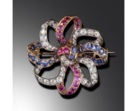 A late Victorian ruby, sapphire and diamond jubilee brooch, c1887, formed from alternate stylised ribbons set with rubies, sa